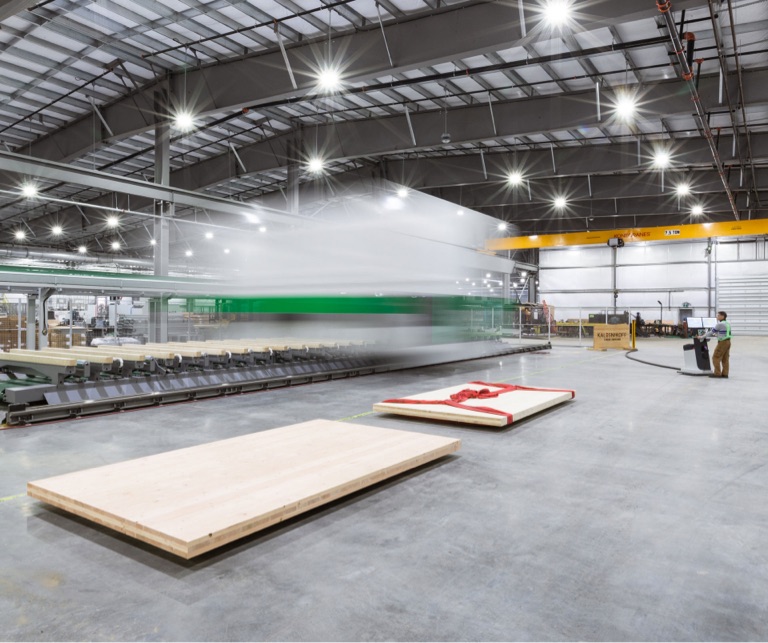 mass timber products facility with two glulam panels on production floor