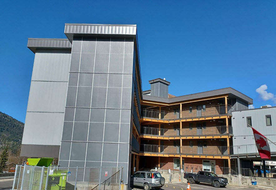 Exterior photo shows mass timber walkways.