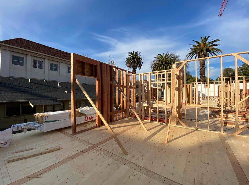 This multi-family housing development features exposed Glulam beams and columns.