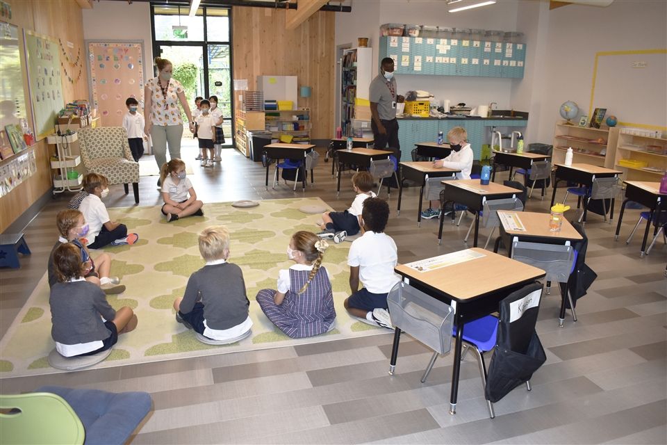 Children learning in a mass timber classroom once the build is finished