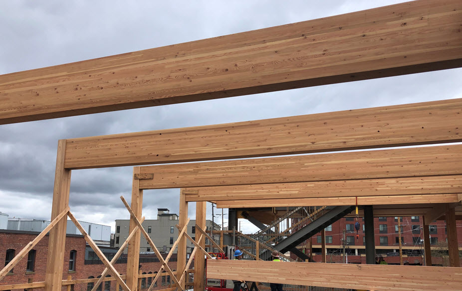 Photo of prefabricated glulam beams on construction site