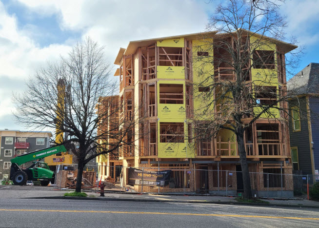 This mass timber multi-family residence is topped out.