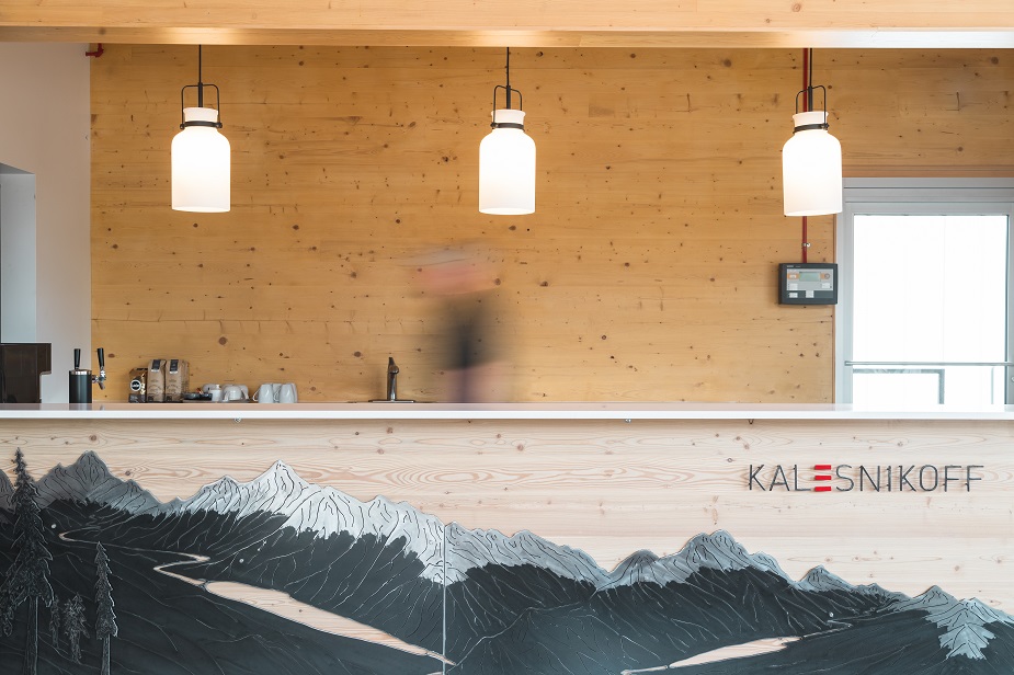 Mass timber reception desk inside Kalesnikoff's new Welcome Center